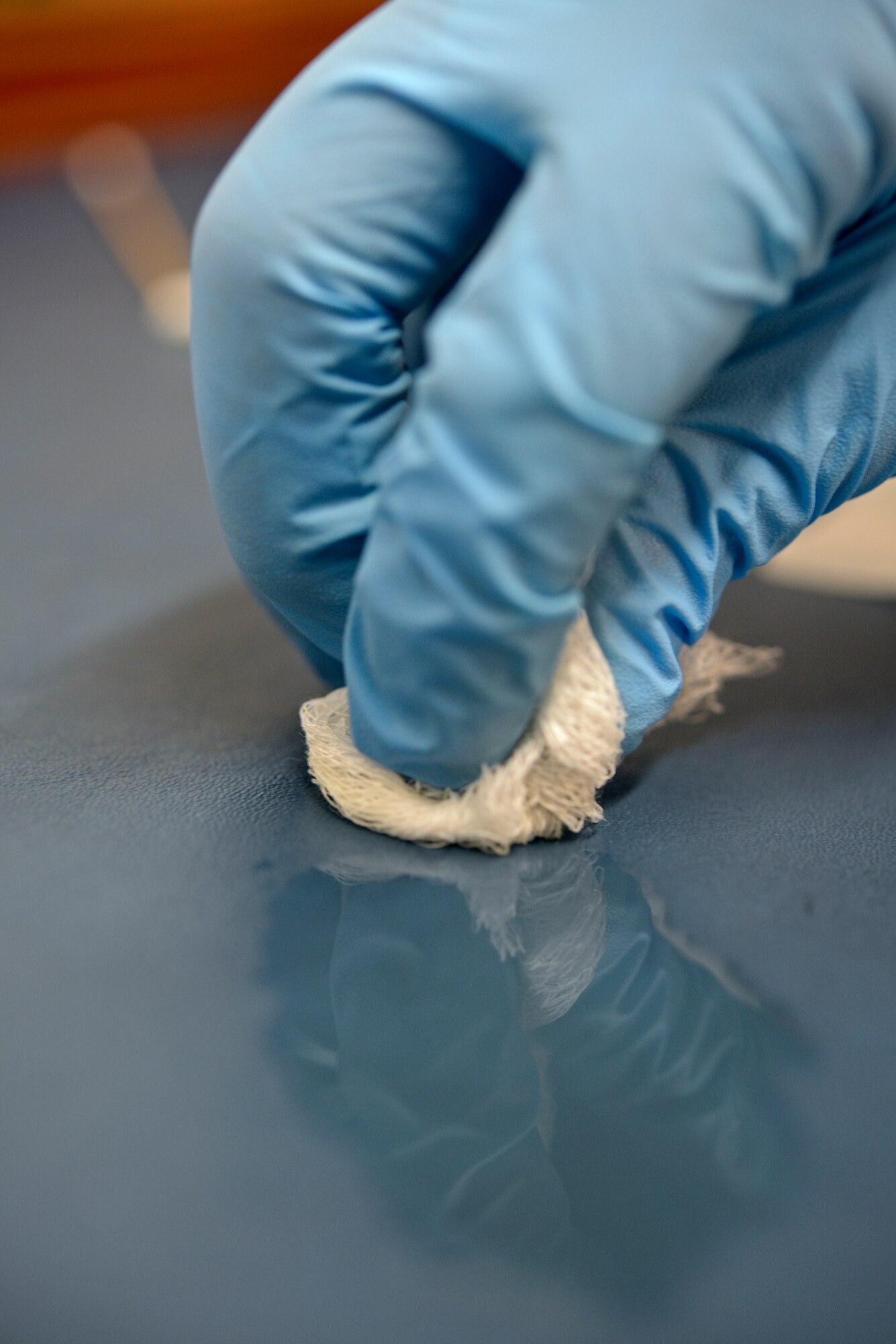 U.S. Air Force Senior Airman Alexandria Delguidice, 100th Operations Support Squadron Aircraft Flight Equipment journeyman, soaks a gauze pad in cleaner lubricant and preservative Sept. 3, 2015, on RAF Mildenhall, England. Delguidice used CLP to help remove dirt and debris, and lubricate the moving parts of an M-9 pistol. (U.S. Air Force photo by Staff Sgt. Micaiah Anthony/Released)