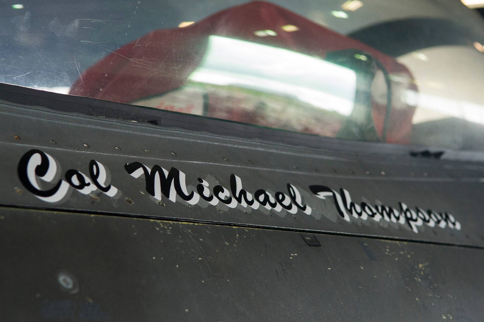The name of the new 52nd Operations Group commander, U.S. Air Force Col. Michael Thompson, is displayed on an F-16 Fighting Falcon fighter aircraft during the 52nd OG change of command ceremony in Hangar one at Spangdahlem Air Base, Germany, Sep. 4, 2015. It is tradition for the name of the new 52nd OG commander to have their name on the group’s aircraft. (U.S. Air Force photo by Airman 1st Class Luke Kitterman/Released)  