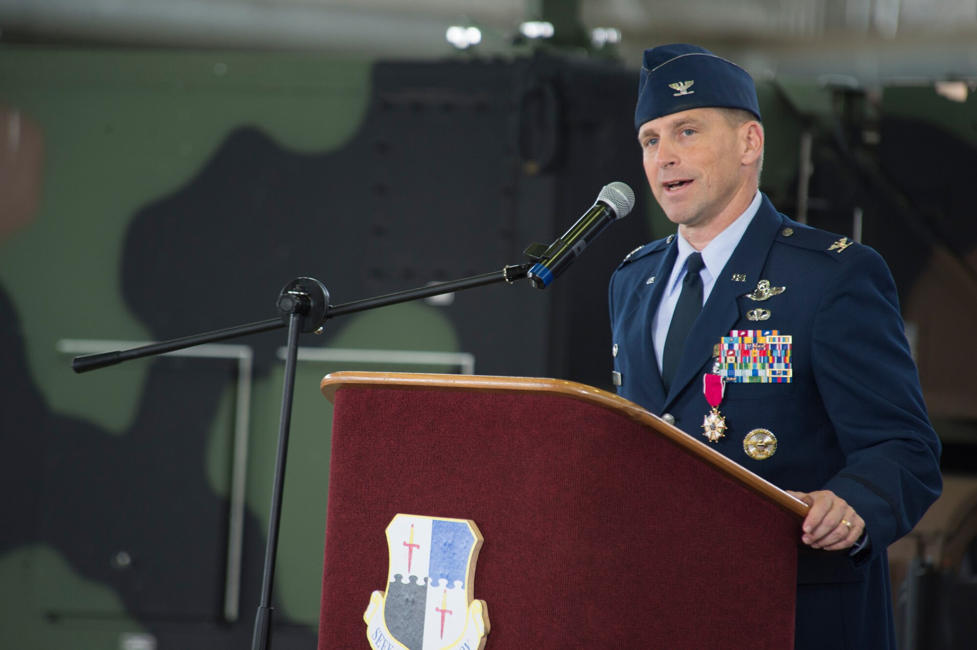 U.S. Air Force Col. Robert Winkler, former 52nd Operations Group commander, speaks during the 52nd OG change of command ceremony in Hangar one at Spangdahlem Air Base, Germany, Sep. 4, 2015. Winkler spoke about his time as the 52nd OG commander and the support he had from his unit and family. (U.S. Air Force photo by Airman 1st Class Luke Kitterman/Released)