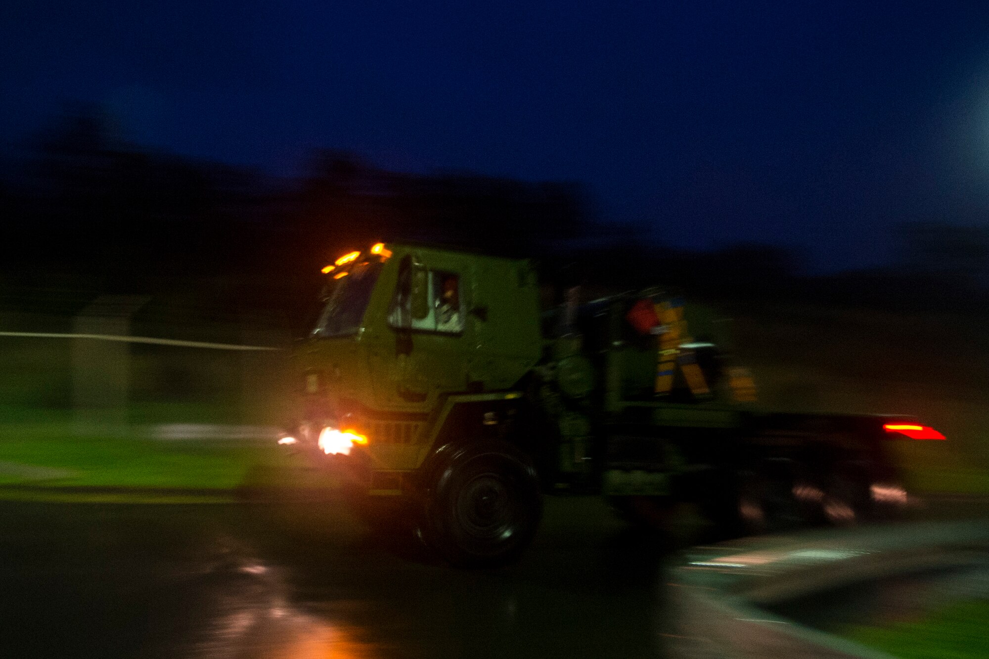 A U.S. Air Force convoy assigned to the 606th Air Control Squadron drives down a road at Spangdahlem Air Base, Germany, Sep. 1, 2015. The convoy was the largest to date, consisting of 121 Airmen, 40 vehicles and two TPS-75 radars all traveling to Poland. The 606th ACS will set up two operating bases in Poland working to jointly control airspace. (U.S. Air Force photo by Airman 1st Class Luke Kitterman/Released)