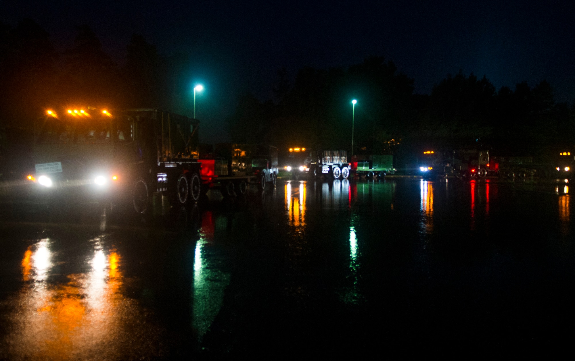 A U.S. Air Force convoy assigned to the 606th Air Control Squadron prepares to travel to Poland at Spangdahlem Air Base, Germany, Sep. 1, 2015. The convoy was the largest to date, consisting of 121 Airmen, 40 vehicles and two TPS-75 radars. The 606th ACS will set up two operating bases in Poland working to jointly control airspace. (U.S. Air Force photo by Airman 1st Class Luke Kitterman/Released)
