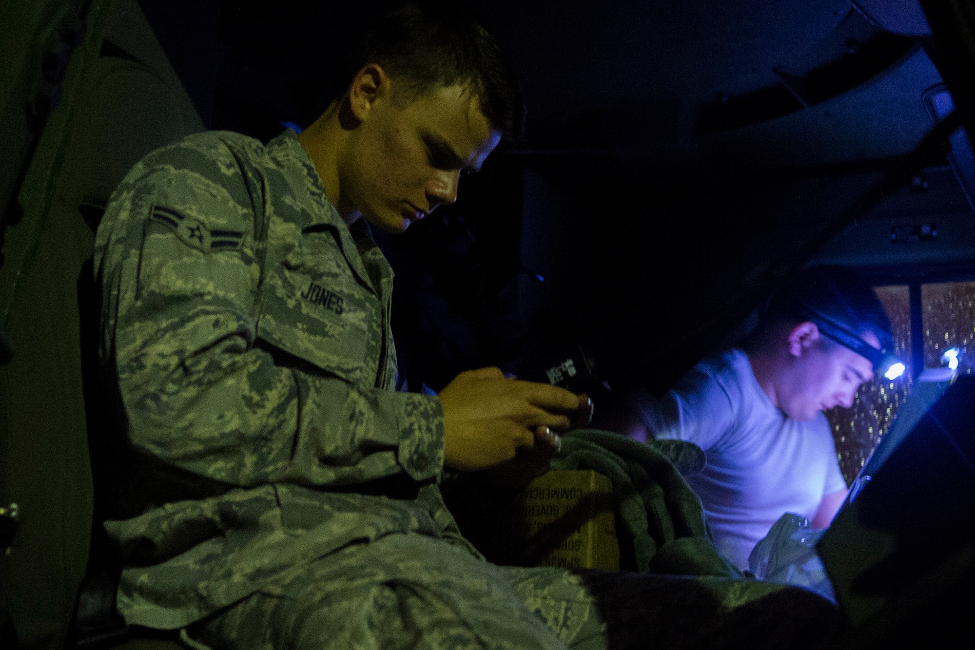 Two Airmen assigned to the 606th Air Control Squadron sit in a vehicle at Spangdahlem Air Base, Germany, Sep. 1, 2015, before convoying 683 miles to Poland. The convoy was the largest to date, consisting of 121 Airmen, 40 vehicles and two TPS-75 radars. The 606th ACS will set up two operating bases in Poland working to jointly control airspace. (U.S. Air Force photo by Airman 1st Class Luke Kitterman/Released)