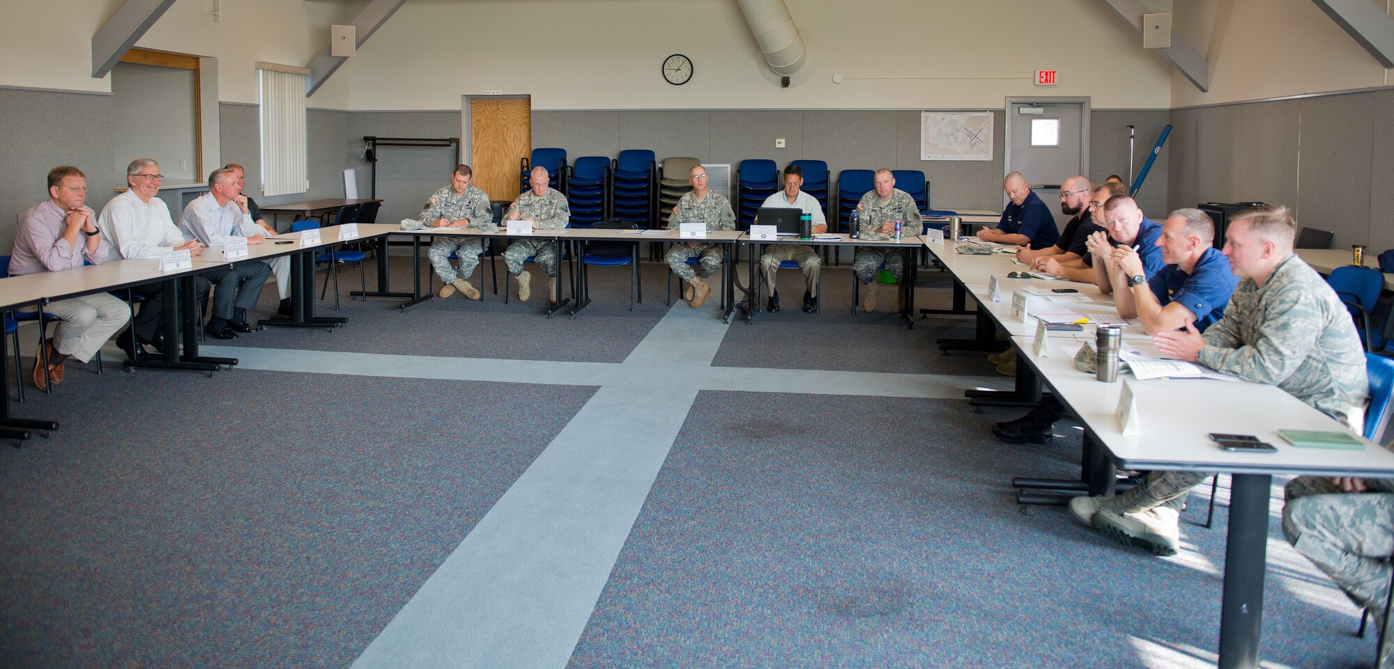 Col. James M. LeFavor, 102 Intelligence Wing Commander, first from right, briefs Russell C. Deyo, Under Secretary for Management at the U.S. Department of Homeland Security, second from left. 