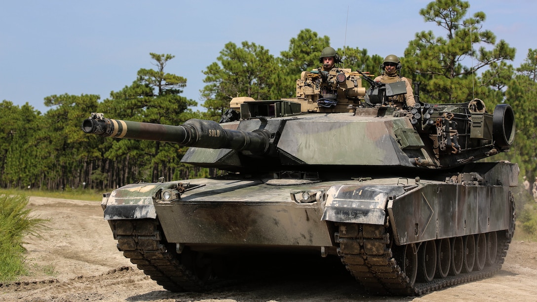Marines with Alpha Company, 2nd Tank Battalion, arrive at Landing Zone Dodo to meet Marines with Golf Company, 2nd Battalion, 2nd Marine Regiment, during an integrated exercise at LZ Dodo, Camp Lejeune, N.C., Sept. 2, 2015. The purpose of the exercise was to allow Marine infantry and tankers to work together.