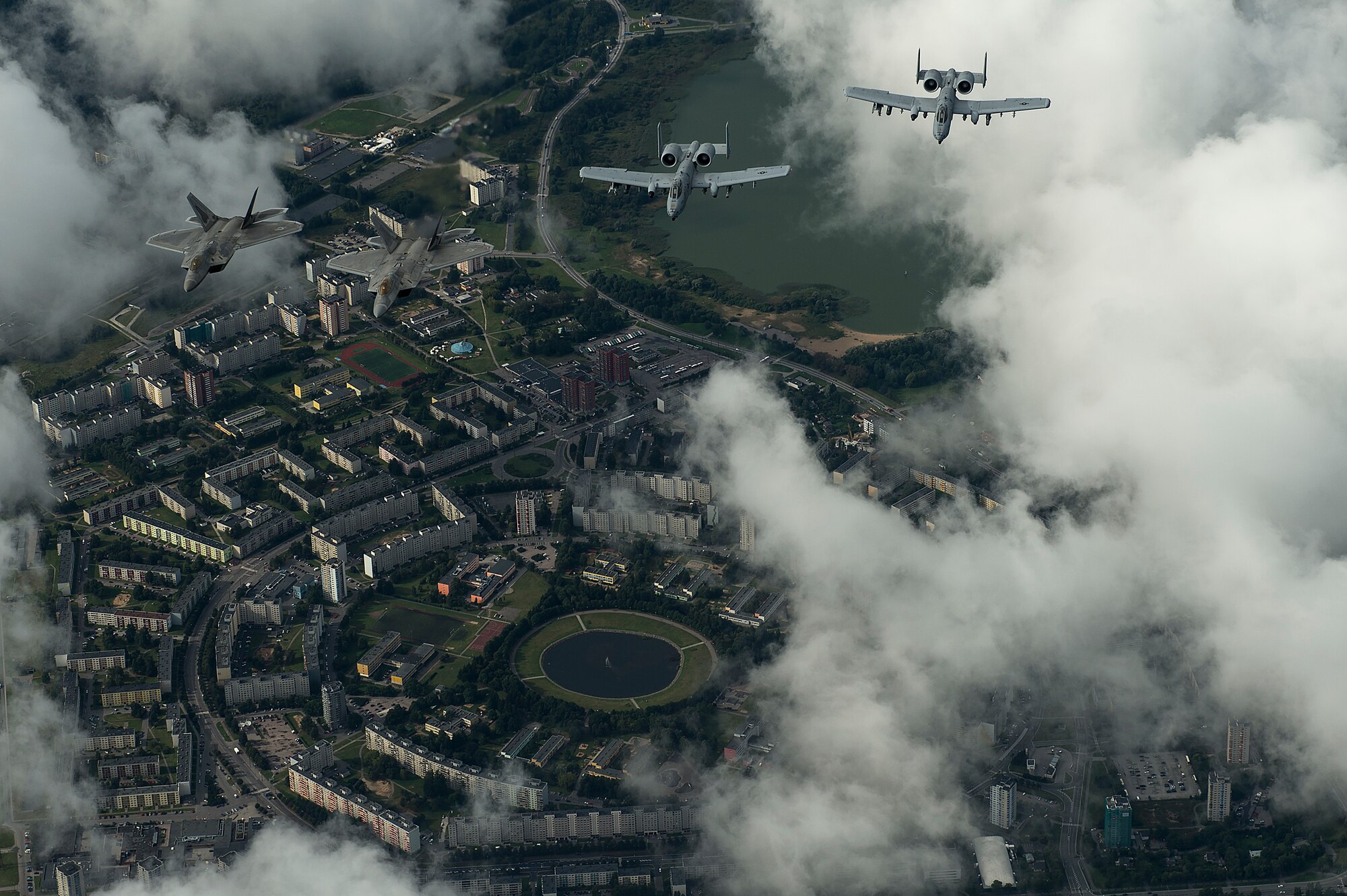 U.S. Air Force F-22 Raptors from the 95th Fighter Squadron, Tyndall Air Force Base, Fla., and A-10 Thunderbolt IIs from the 303rd Fighter Squadron part of the 442nd Fighter Wing, Whiteman Air Force Base, Mo., fly in formation over Tallinn, Estonia, Sept. 4, 2015. The U.S. Air Force has deployed four F-22 Raptors, one C-17 Globemaster III, approximately 60 Airmen and associated equipment to Spangdahlem Air Base, Germany. While these aircraft and Airmen are in Europe, they will conduct air training with other Europe-based aircraft. The United States is committed to ongoing reassurance efforts to NATO allies in Eastern Europe. (U.S. Air Force photo by Tech. Sgt. Jason Robertson/Released)