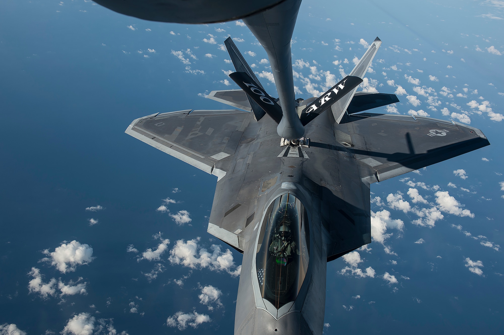 A U.S. Air Force F-22 Raptor from the 95th Fighter Squadron, Tyndall Air Force Base, Fla., conducts aerial refueling with a KC-135 Stratotanker from the 100th Air Refueling Wing, RAF Mildenhall Air Base, England, Sept. 4, 2015, over the Baltic Sea. The U.S. Air Force has deployed four F-22 Raptors, one C-17 Globemaster III, approximately 60 Airmen and associated equipment to Spangdahlem Air Base, Germany. While these aircraft and Airmen are in Europe, they will conduct air training with other Europe-based aircraft. (U.S. Air Force photo by Tech. Sgt. Jason Robertson/Released)
