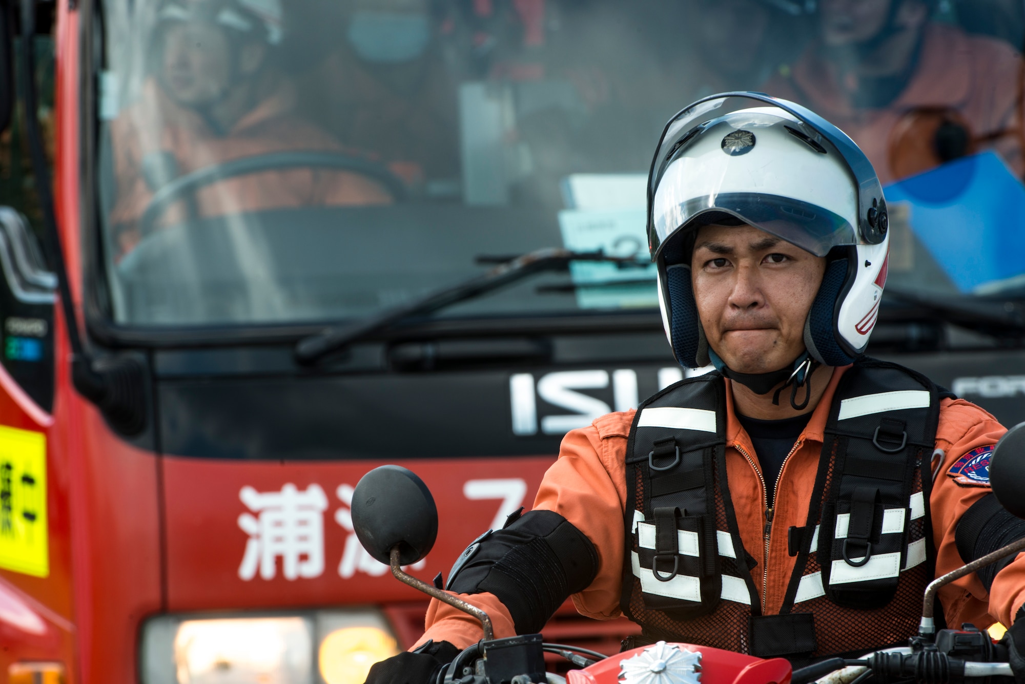 An Okinawan emergency responder awaits the signal to arrive on-scene to a simulated disaster relief site during an Okinawa Prefectural Government disaster response exercise at Atta Port, Japan, Sept. 5, 2015. This year’s exercise, which marks the first time involving the 18th Wing at Kadena Air Base, Japan, gave participants and spectators an understanding of how the 82 separate entities from U.S. military, JSDF and local emergency responders work together to save lives in the wake of devastation from a natural disaster in the region. (U.S. Air Force photo by Staff Sgt. Maeson L. Elleman)