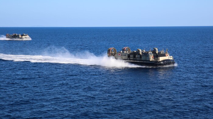 Two Japan Maritime Self-Defense Force Landing Craft Air Cushion vessels maneuver past Japanese ship Hyuga during Exercise Dawn Blitz 2015 off the coast of Marine Corps Base Camp Pendleton, California, Sept. 3, 2015. Dawn Blitz is a multinational training exercise designed to enhance Expeditionary Strike Group Three and 1st Marine Expeditionary Brigade's ability to conduct sea-basing operations, amphibious landings, and command and control capabilities alongside coalition forces. 