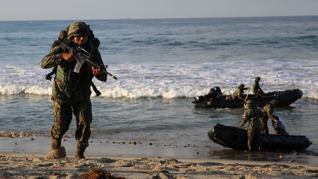 Marines with Zodiac Battalion, Mexican Naval Infantry Forces, storm the shoreline near San Onofre beach during an amphibious exercise as a part of Exercise Dawn Blitz 2015 aboard Marine Corps Base Camp Pendleton, Calif., Sept. 5, 2015. The purpose of DB15 is to establish strong relationships between coalition forces, to include Japan, Mexico and New Zealand to strengthen operations in joint amphibious environments.