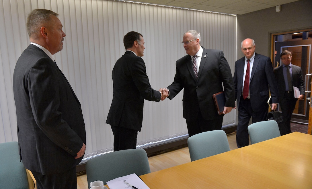 U.S. Deputy Defense Secretary Bob Work, center right, shakes hands with senior Icelandic officials as he prepares to receive a strategic briefing at the Ministry of Foreign Affairs in Reykjavik, Iceland, Sept. 7, 2015. DoD photo by Glenn Fawcett