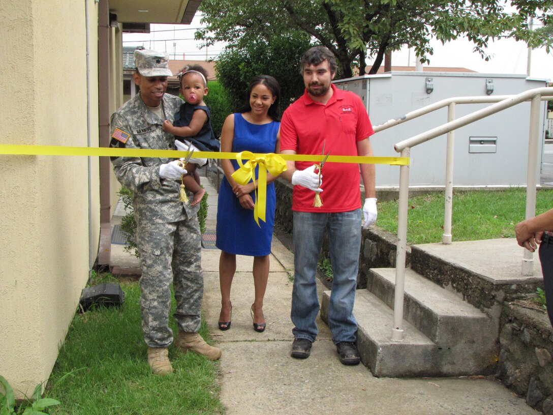 DLA Energy Pacific at Korea Commander Army Lt. Col. Wheeler Manning, with his daughter and wife, along with U.S. Army Corps of Engineer Jared McCormick cut the ribbon to officially commemorate the completion of DLA Energy Korea Headquarters renocation at Camp Walker, Daegu, Republic of Korea, Sept. 1.