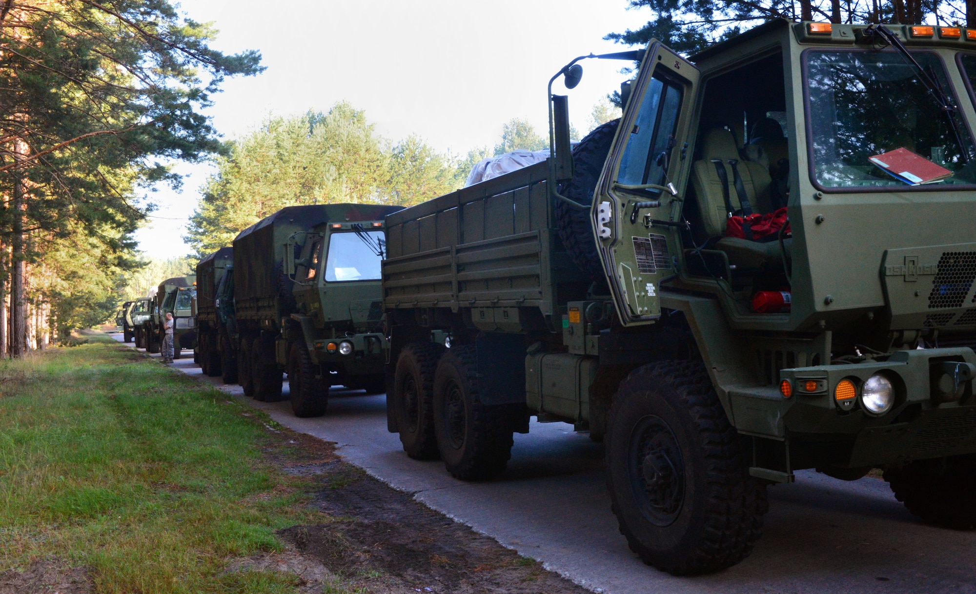 Members of the 606th Air Control Squadron prepare their vehicles to convoy to Poland as part of a convoy from Spangdahlem Air Base, Germany to Poland, Sept. 2, 2015. The 606th ACS later set up two operating bases at Krzesiny and Nadarzyce Air Bases, Poland, to provide tactical air control for Aviation Detachment Rotation 15-4. The U.S. Air Force Aviation Detachment stationed at Łask Air Base, Poland, will host the rotation from Aug. 31 -- Sept. 25, 2015, as the latest training exercise designed to strengthen the interoperability of NATO allies. (U.S. Air Force photo by 2nd Lt. Meredith Mulvihill/Released)