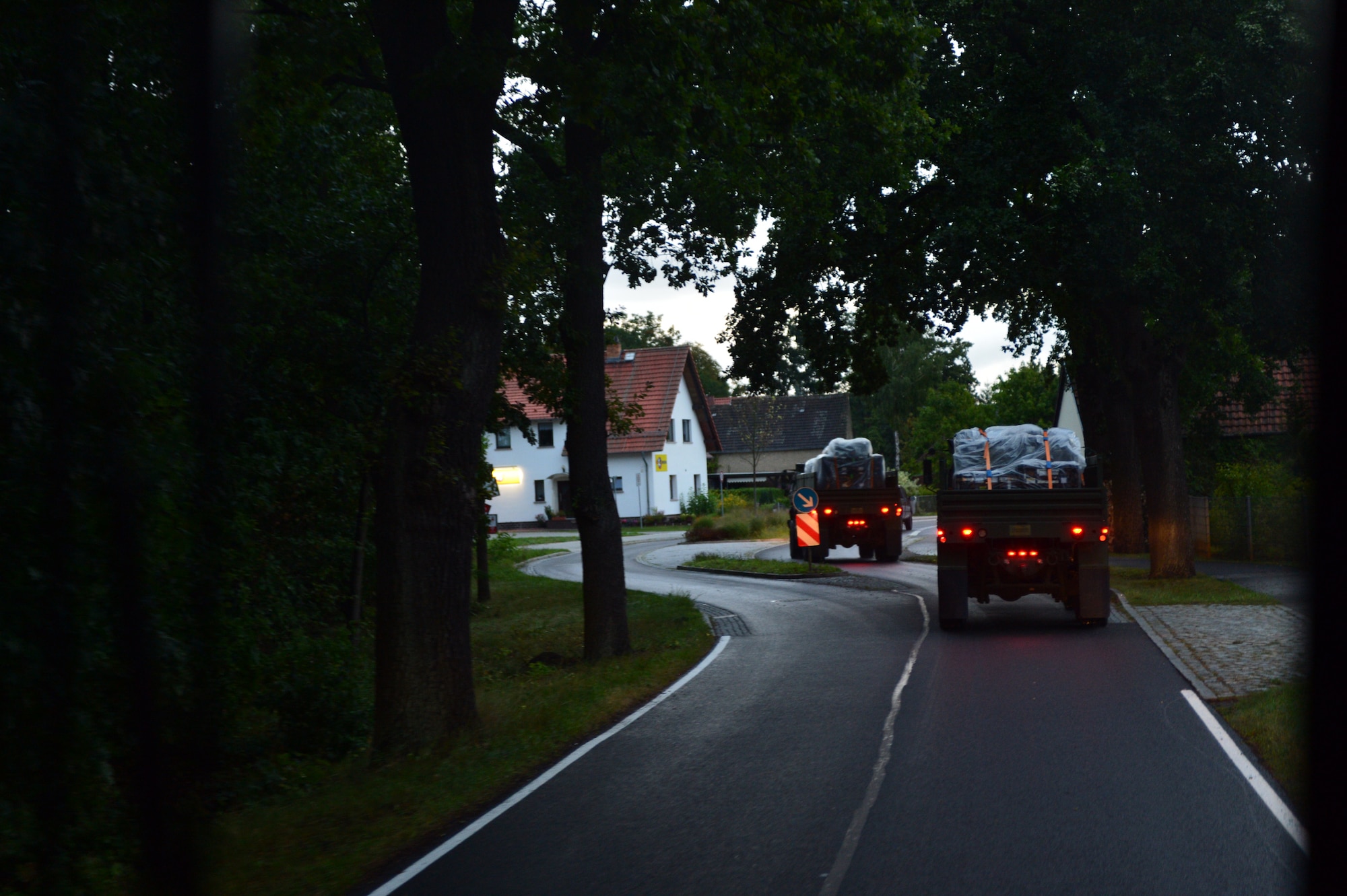 A U.S. Air Force convoy drives through a German village as part of a convoy from Spangdahlem Air Base, Germany to Poland Sept. 1, 2015. The 606th Air Control Squadron travelled over 700 miles in two days to reach destinations at Krzesiny and Nadarzyce Air Bases, Poland, making it the longest 606th ACS convoy to date. The Airmen will participate in Aviation Detachment Rotation 15-4, hosted by the U.S. Air Force Aviation Detachment stationed at Łask Air Base, Poland, as part of the latest training exercise designed to strengthen the interoperability of NATO allies. (U.S. Air Force photo by 2nd Lt. Meredith Mulvihill/Released)