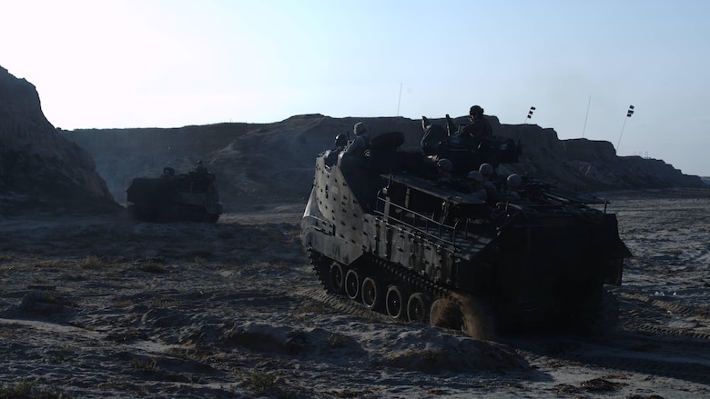 Marines with Alpha Company, 1st Battalion, 5th Marine Regiment provide security on the beach following an amphibious landing as part of Exercise Dawn Blitz 2015 at Marine Corps Base Camp Pendleton, Calif., Sept. 5, 2015. Dawn Blitz is a multinational, amphibious training exercise designed to hone the amphibious landing skills of I Marine Expeditionary Brigade, Expeditionary Strike Group Three and allies of the United States.