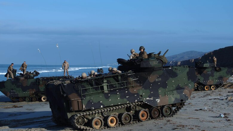 Marines with Alpha Company, 1st Battalion, 5th Marine Regiment provide security on the beach following an amphibious landing as part of Exercise Dawn Blitz 2015 at Marine Corps Base Camp Pendleton, Calif., Sept. 5, 2015. Dawn Blitz is a multinational, amphibious training exercise designed to hone the amphibious landing skills of I Marine Expeditionary Brigade, Expeditionary Strike Group Three and allies of the United States.