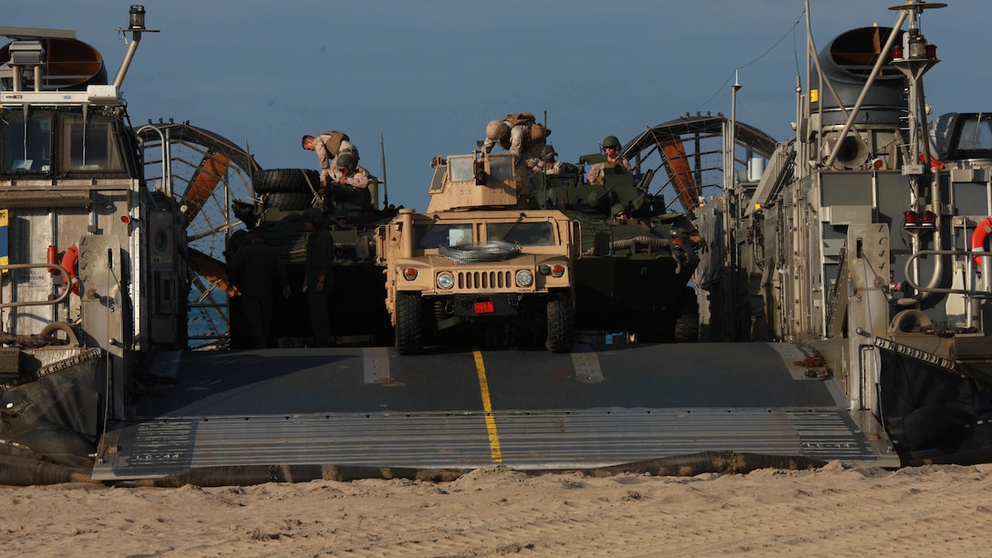 Marines offload vehicles from a landing Craft Air Cushion on to a beach at Marine Corps Base Camp Pendleton, Calif., during Exercise Dawn Blitz 2015, Sept. 5, 2015. Dawn Blitz is a multinational training exercise designed to enhance Expeditionary Strike Group Three and 1st Marine Expeditionary Brigade’s ability to conduct sea-based operations, amphibious landings, and command and control capabilities alongside Japan, Mexico and New Zealand.