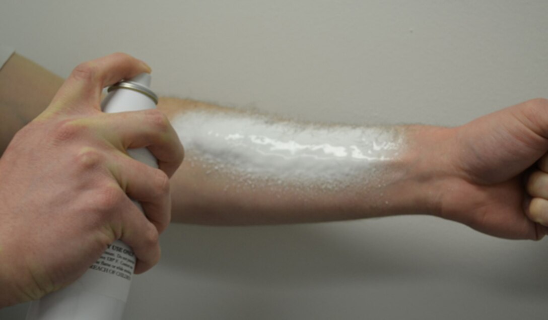 A researcher demonstrates the spray foam, Hemogrip, which could be useful in treating non-compressible hemorrhage wounds in soldiers. Remedium Technologies photo by Matthew Dowling