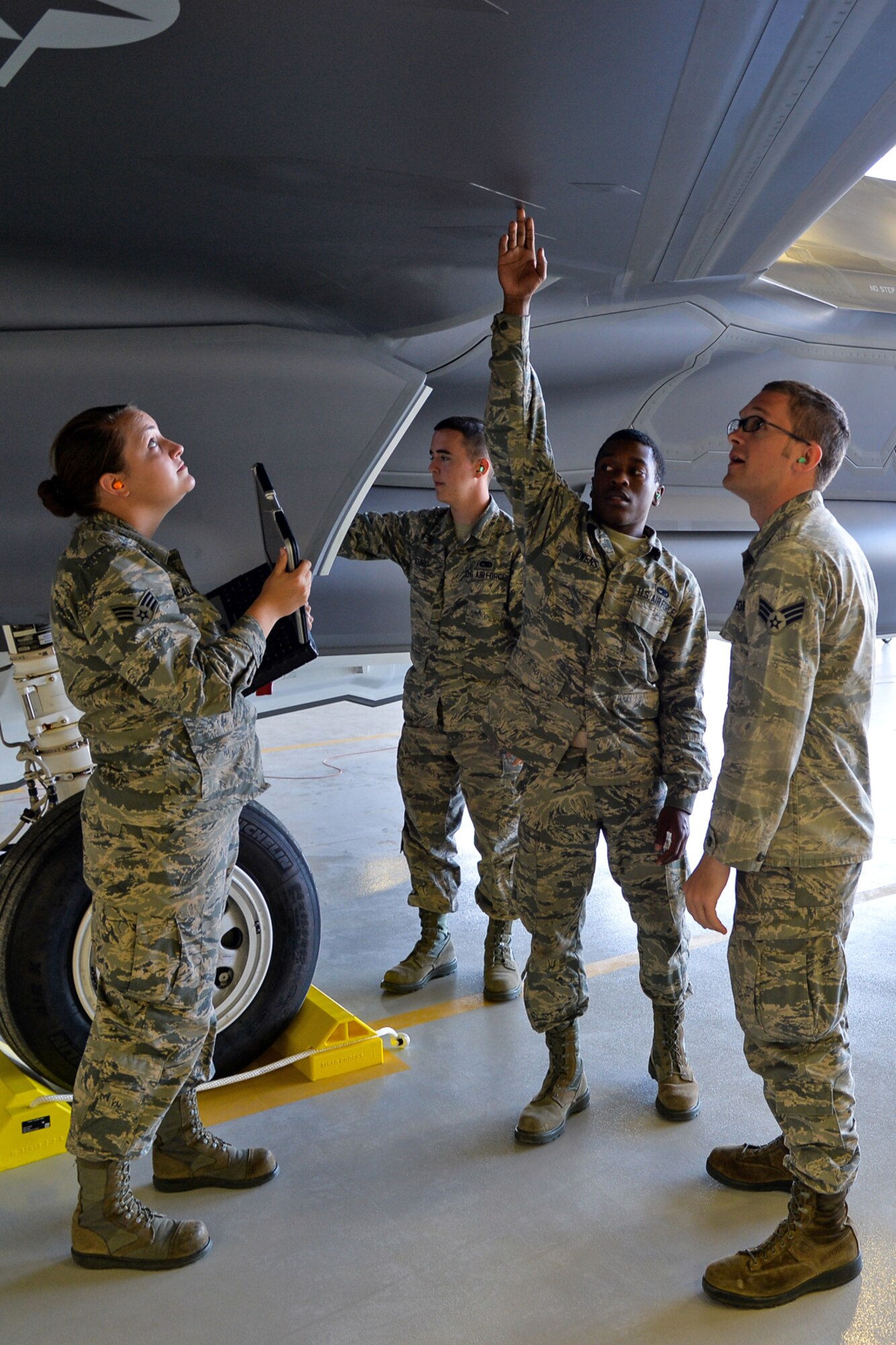 Airmen from the Air Force Reserve's 419th Fighter Wing and active-duty 388th Fighter Wing perform a routine inspection on an F-35A’s internal weapons bay at Hill Air Force Base Sept. 3. (U.S. Air Force photo/R. Nial Bradshaw)