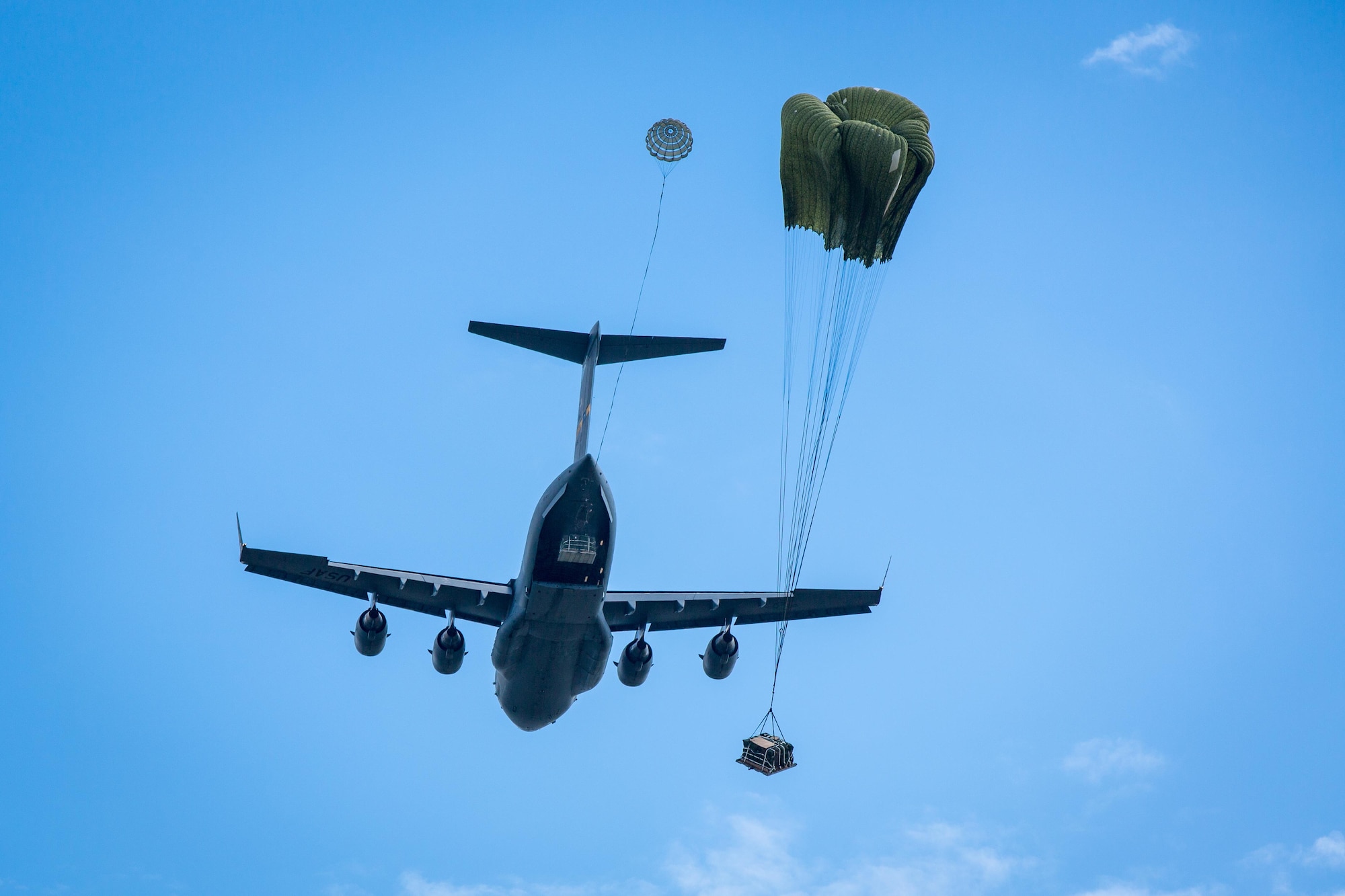 U.S. Army Soldiers of the 824th Quartermaster Company and U.S. Airforce Airmen of the 315th Airlift Wing conduct a joint operations air drop during Combat Support Training Exercise 2015 (CSTX) at Fort McCoy, Wis., Aug. 10, 2015. CSTX is an annual training exercise that includes more than 8,000 Soldiers. (U.S. Army photo by Spc. Russell)