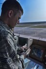 Senior Airman Michael Manella, 1st Special Operations Support Squadron air traffic controller, loads flight progress strips to prepare for a departure phase at Hurlburt Field, Fla., August 25, 2015. Air traffic controllers track aircraft movement using strips that include information on the aircraft and its flight path. (U.S. Air Force photo/Senior Airman Jeff Parkinson)