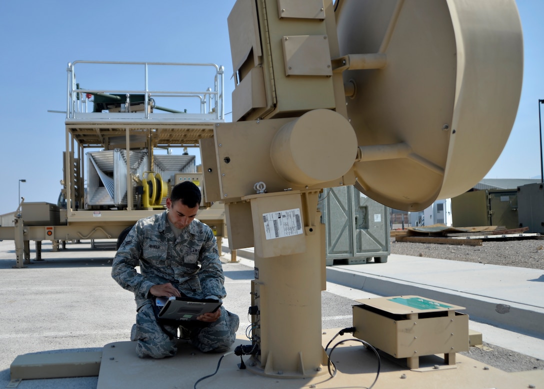 Airman 1st Class Stephen Parker, a 32nd Aircraft Communications Maintenance Squadron ground control station maintainer, powers a ground data terminal used to transmit signals needed to fly both the MQ-1B Predator and MQ-9 Reaper Aug. 19, 2015, at Creech Air Force Base, Nev. The ground data terminal is responsible for providing the line-of-sight flying capabilities of an RPA. (U.S. Air Force photo/Airman 1st Class Christian Clausen)
