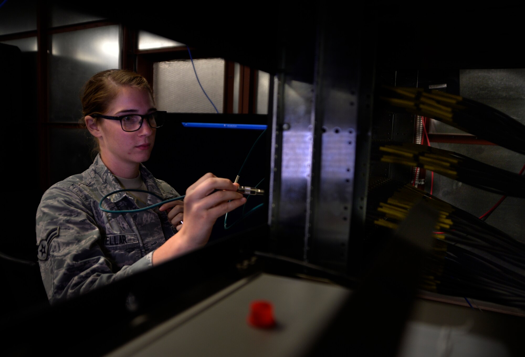 Airman 1st Class Ashley Kellar, a 432nd Aircraft Communications Maintenance Squadron radio frequencies technician, patches in a ground control station for satellite link Aug. 19, 2015, at Creech Air Force Base, Nev. The 432nd ACMS is the only unit in the Air Force dedicated to maintaining the communications network of the remotely piloted aircraft enterprise. (U.S. Air Force photo/Airman 1st Class Christian Clausen)