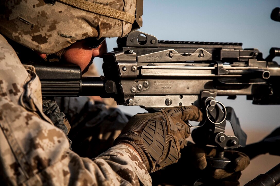 KUWAIT (Aug. 17, 2015) A U.S. Marine with Lima Company, Battalion Landing Team 3rd Battalion, 1st Marine Regiment, 15th Marine Expeditionary Unit, fires at targets with his M240B machine gun during squad-level training. Elements of the 15th MEU are ashore in Kuwait for sustainment training to maintain and enhance the skills they developed during their pre-deployment training period.  The 15th MEU is embarked with the Essex Amphibious Ready Group and deployed to maintain regional security in the U.S. 5th Fleet area of operations. (U.S. Marine Corps photo by Cpl. Elize McKelvey/Released)