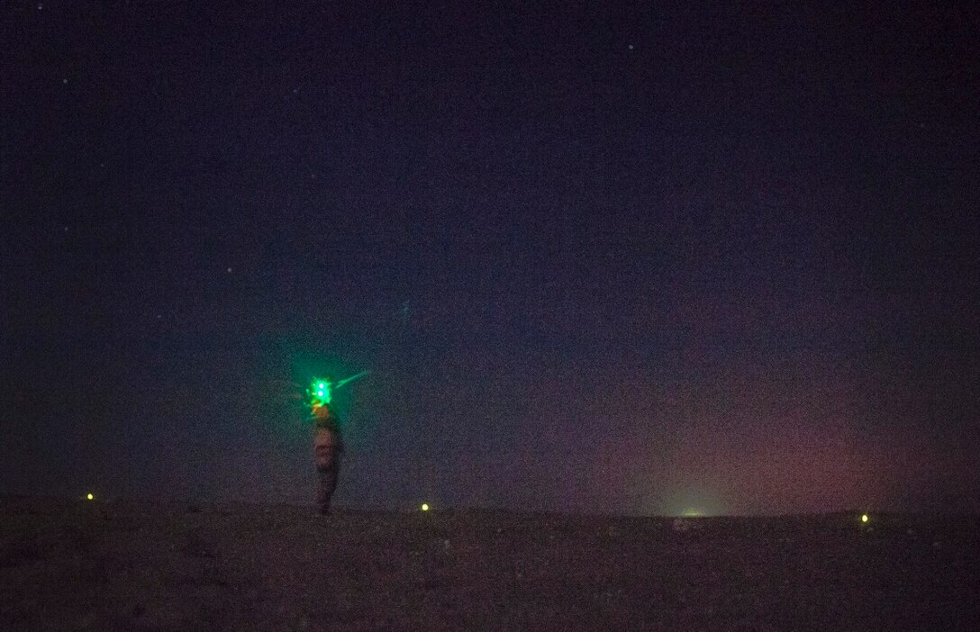 KUWAIT (Aug. 23, 2015) A U.S. Marine with Lima Company, Battalion Landing Team 3rd Battalion, 1st Marine Regiment, 15th Marine Expeditionary Unit, prepares to launch an RQ-11 Raven during a training exercise. The Raven is a small, hand-launched, remote-controlled, unmanned aerial vehicle that has day and night aerial intelligence, surveillance, target acquisition, and reconnaissance capabilities. Elements of the 15th MEU are ashore in Kuwait for sustainment training to maintain and enhance the skills they developed during their pre-deployment training period.  The 15th MEU is embarked with the Essex Amphibious Ready Group and deployed to maintain regional security in the U.S. 5th Fleet area of operations. (U.S. Marine Corps photo by Cpl. Elize McKelvey/Released)