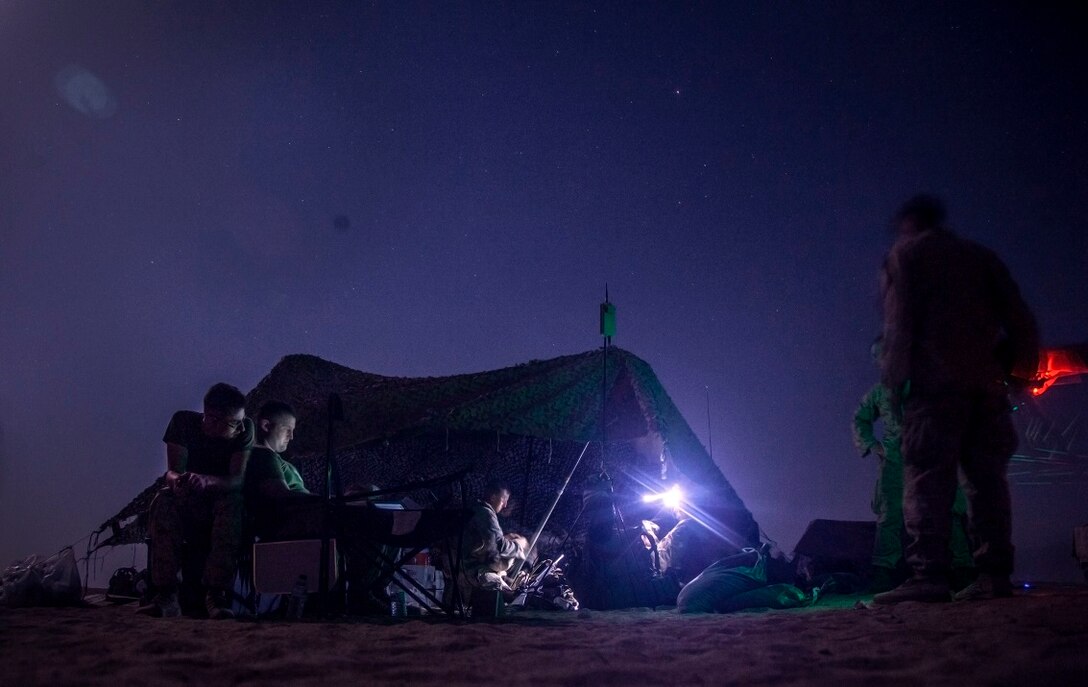 KUWAIT (Aug.  23, 2015) U.S. U.S. Marines with Lima Company, Battalion Landing Team 3rd Battalion, 1st Marine Regiment, 15th Marine Expeditionary Unit, set up an RQ-11 Raven prior to launching during a training exercise. The Raven is a small, hand-launched, remote-controlled, unmanned aerial vehicle that has day and night time aerial intelligence, surveillance, target acquisition, and reconnaissance capabilities. Elements of the 15th MEU are ashore in Kuwait for sustainment training to maintain and enhance the skills they developed during their pre-deployment training period.  The 15th MEU is embarked with the Essex Amphibious Ready Group and deployed to maintain regional security in the U.S. 5th Fleet area of operations. (U.S. Marine Corps photo by Cpl. Elize McKelvey/Not Released)