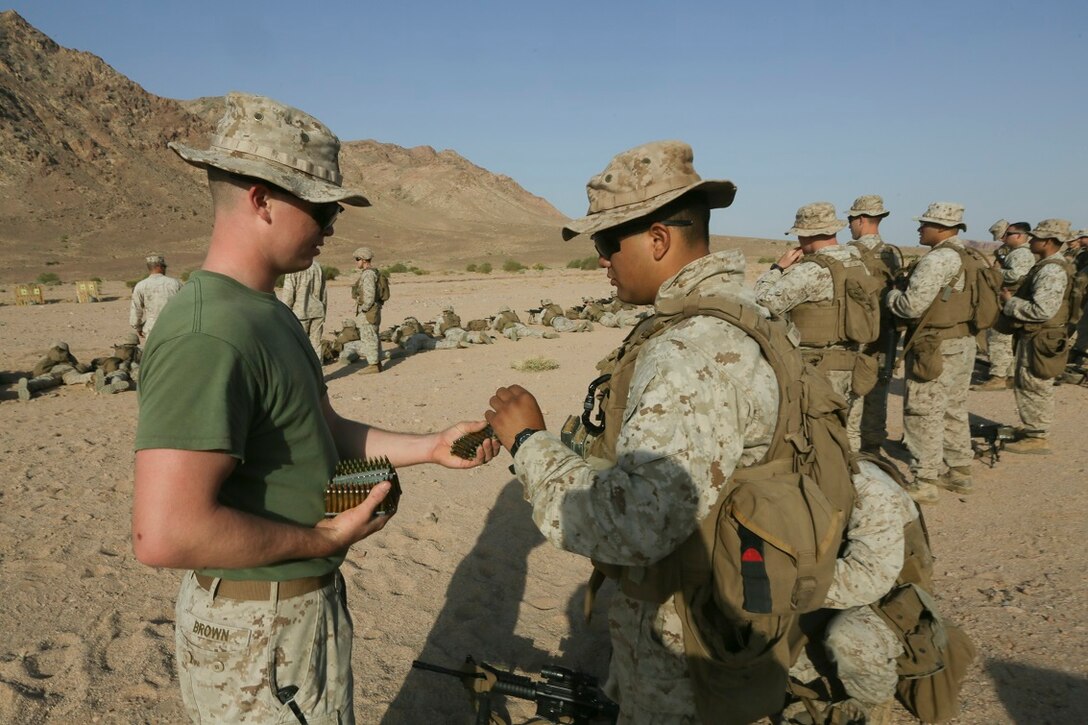 Southwest Asia (Aug. 23, 2015) U.S. Marine Lance Cpl. Nickolaus Brown distributes ammunition during a range setup.  Brown is a rifleman with India Company Battalion Landing Team 3rd Battalion, 1st Marine Regiment, 15th Marine Expeditionary Unit. The 15th MEU is deployed throughout Southwest Asia to maintain regional security in the U.S. 5th Fleet area of operations. The 15th MEU provides flexible, responsive options across the range of military operations to support regional security in the U.S. 5th Fleet AOR. ( (U.S. Marine Corps photo by Sgt. Jamean Berry/Released)