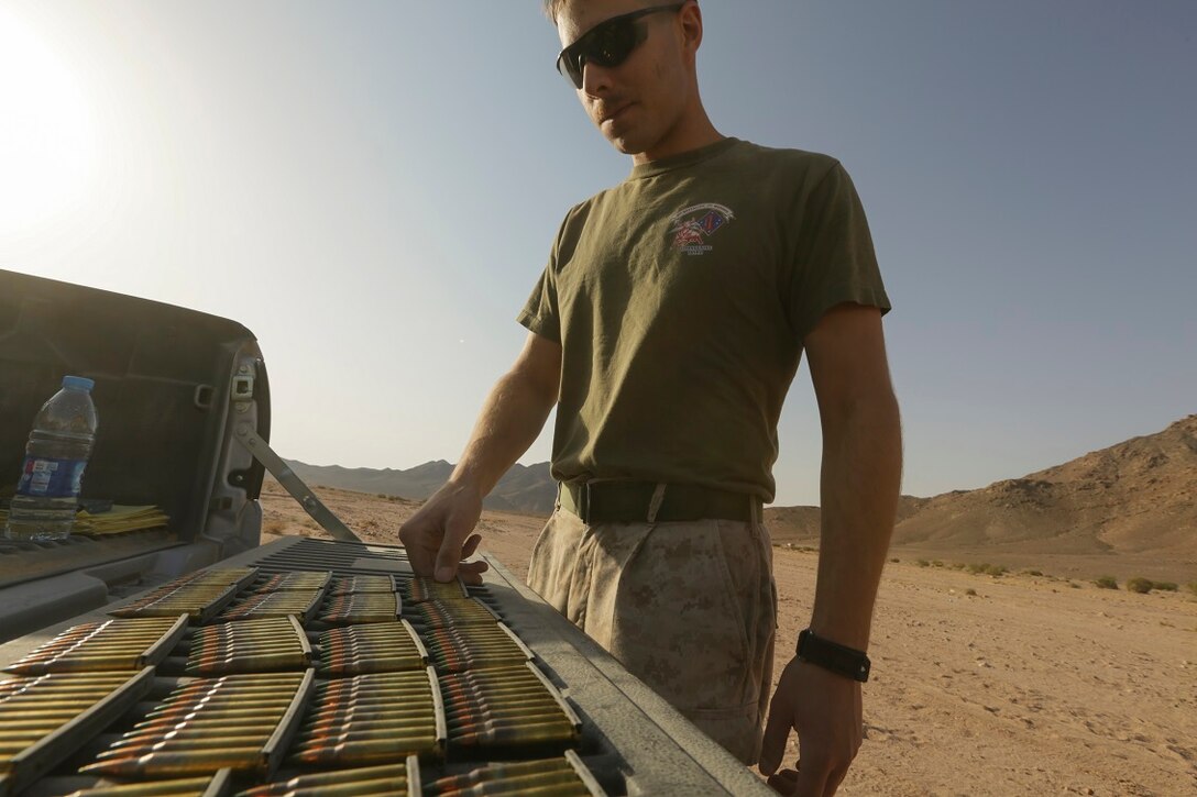 Southwest Asia (Aug. 23, 2015)  U.S. Marine Lance Cpl. Blake Schneider stages ammunition during a range setup. Schneider is a rifleman with India Company, Battalion Landing Team 3rd Battalion, 1st Marine Regiment, 15th Marine Expeditionary Unit. The 15th MEU is deployed throughout Southwest Asia to maintain regional security in the U.S. 5th Fleet area of operations.  The 15th MEU provides flexible, responsive options across the range of military operations to support regional security in the U.S. 5th Fleet AOR. (U.S. Marine Corps photo by Sgt. Jamean Berry/Released)