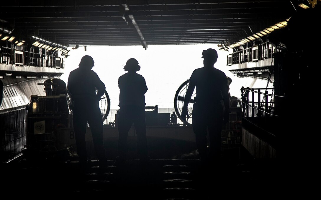 ARABIAN GULF (Sept. 3, 2015)  U.S. Marines and Sailors with the 15th Marine Expeditionary Unit and Essex Amphibious Ready Group finish escorting a landing craft, air cushion in the well deck aboard the amphibious assault ship USS Essex (LHD 2). The 15th MEU is embarked aboard the Essex Amphibious Ready Group and deployed to maintain regional security in the U.S. 5th Fleet area of operations. (U.S. Marine Corps photo by Cpl. Elize McKelvey/Released)