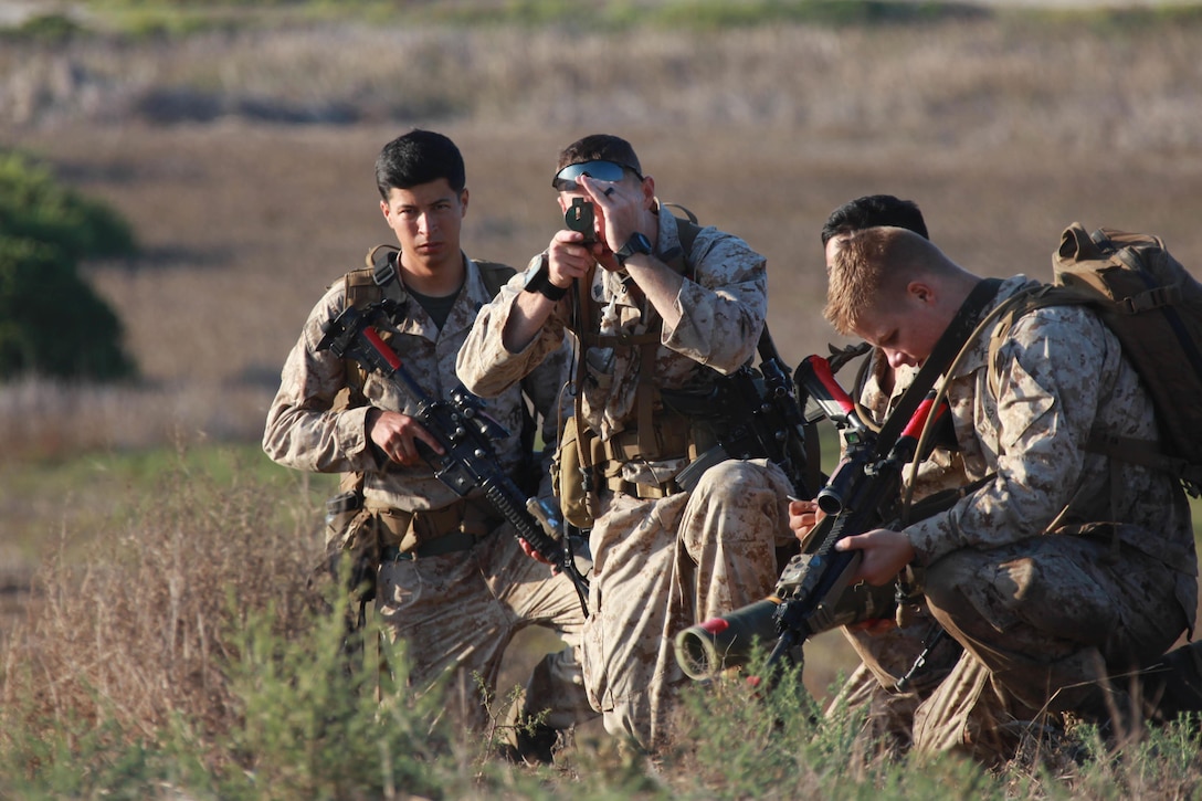 Marines use a compass on Camp Pendleton, Calif., Sept. 5, 2015, during Exercise Dawn Blitz 2015. Dawn Blitz is a multinational training exercise involving sea-based operations, amphibious landings, and command and control capabilities training with Japan, Mexico and New Zealand. The Marines are assigned to the 1st Marine Division’s 1st Battalion, 5th Marine Regiment. U.S. Marine Corps photo by Lance Cpl. David Staten