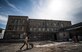 Airman 1st Class Cole Kasten, a 52nd Civil Engineer Squadron pavement and heavy equipment operator, pushes a wheel barrel before mixing cement for a ramp at Public School No. 4 in Gori, Georgia, Aug. 28, 2015. Kasten, along with a six-person Air Force team and Georgian army engineers, sometimes worked 16-hour days during a 30-day school renovation project that will help the children of Gori. Humanitarian and civic assistance projects enhance operational readiness of military personnel while providing mutual support to the host nation's population. (U.S. Air Force photo/Staff Sgt. Sara Keller)