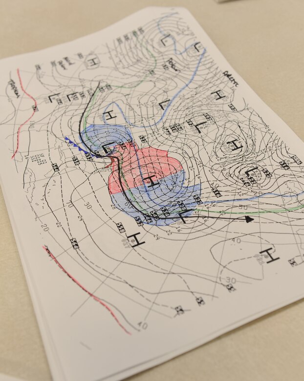 A synoptic scale analysis chart sits on display during the 335th Training Squadron weather initial skills course Sept. 3, 2015, Keesler Air Force Base, Miss. Throughout the course, Airmen, Marines, Sailors and Coastguardsmen learn the foundations of weather forecasting with maps, radar and manual observation. (U.S. Air Force photo by Kemberly Groue)