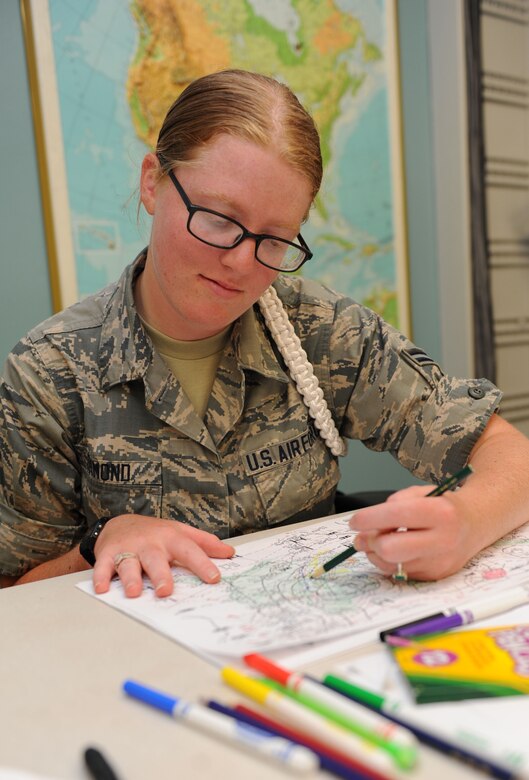 Airman 1st Class Kristen Ormond,  335th Training Squadron student, completes a synoptic scale analysis exam during the weather initial skills course Sept. 3, 2015, Keesler Air Force Base, Miss. Throughout the course, Airmen, Marines, Sailors and Coastguardsmen learn the foundations of weather forecasting with maps, radar and manual observation. (U.S. Air Force photo by Kemberly Groue)