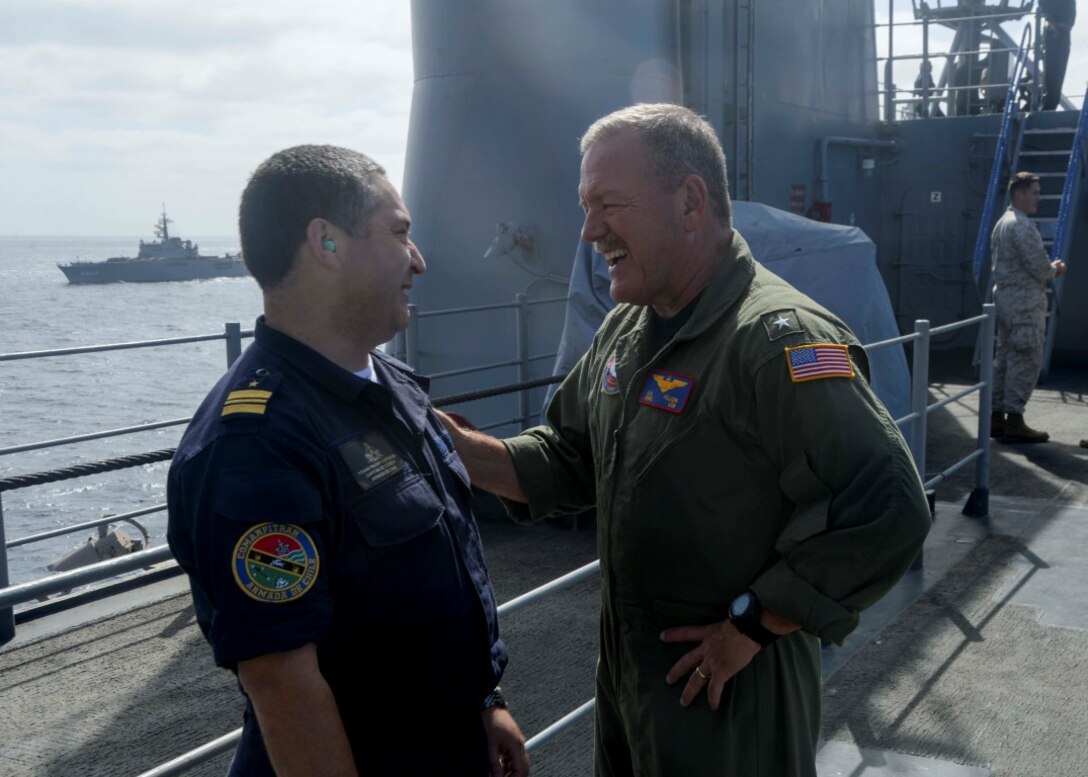 150904-N-GZ228-239 PACIFIC OCEAN (Sept. 4, 2015) Rear Adm. Daniel Fillion, commander, Expeditionary Strike Group (ESG) 3, converses with Chilean naval service member Yovan Pauvif Fuentealba, Capitan De Corbeta, Armada De Chile, on vultures row of the amphibious assault ship USS Boxer (LHD 4). Boxer is currently underway off the coast of Southern California participating in Dawn Blitz 2015 (DB-15). DB-15 is a multinational training exercise being conducted by Expeditionary Strike Group 3 (ESG-3) and 1st Marine Expeditionary Brigade (1st MEB) to build U.S., Japan, Mexico and New Zealand’s amphibious, and command and control capabilities through live, simulated and constructive military training activities. (U.S. Navy photo by Mass Communication Specialist 3rd Class Jesse Monford/Released)