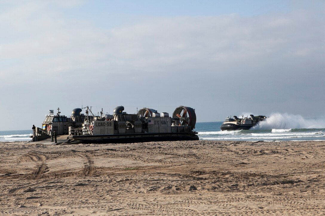 150905-N-MZ309-154 CAMP PENDLETON (Sept. 5, 2015) Two landing craft air cushions (LCAC) land on the beach during an amphibious landing for Exercise Dawn Blitz 2015. Dawn Blitz 2015 is a scenario-driven exercise designed to train the U.S. Navy and Marine Corps in operations expected of an amphibious task force while also building U.S. and coalition operational interoperability. (U.S. Navy photo by Mass Communication Specialist 2nd Class Ryan Riley/Released)