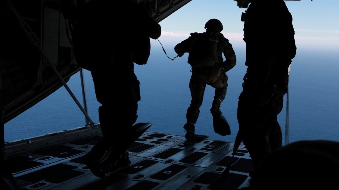 A Marine with Charlie Company, 1st Marine Raider Battalion, Marine Corps Special Operations Command, jumps from a C-130 for an open water parachute landing off the coast of Marine Corps Base Camp Pendleton, Calif., during Exercise Dawn Blitz 2015, Sept. 6. Dawn Blitz is a multinational training exercise designed to enhance Expeditionary Strike Group Three and 1st Marine Expeditionary Brigade’s ability to conduct sea-based operations, amphibious landings, and command and control capabilities alongside Japan, Mexico and New Zealand.