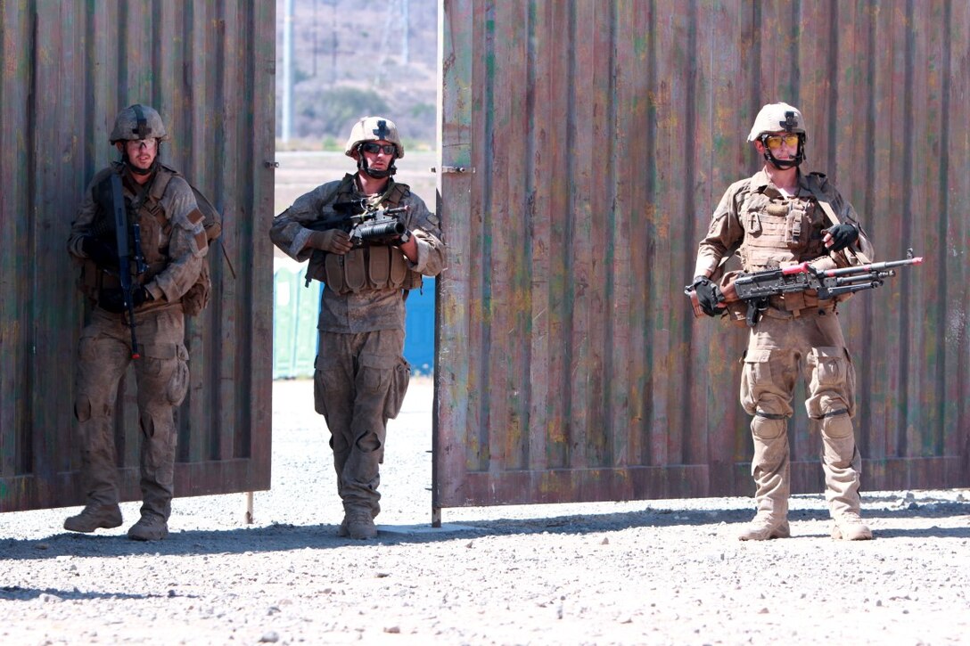 Soldiers with 1st Royal New Zealand Infantry Regiment enter the Infantry Immersion Trainer during Exercise Dawn Blitz, at Marine Corps Base Camp Pendleton, Calif., Sept. 7, 2015. The IIT is a training facility that provides individuals with stressful scenarios they might encounter during combat operations in urban areas. Dawn Blitz is a multinational amphibious exercise that promotes interoperability between the U.S. Navy, Marine Corps and coalition partners. (U.S. Marine Corps photo taken by Sgt. Joseph Scanlan)