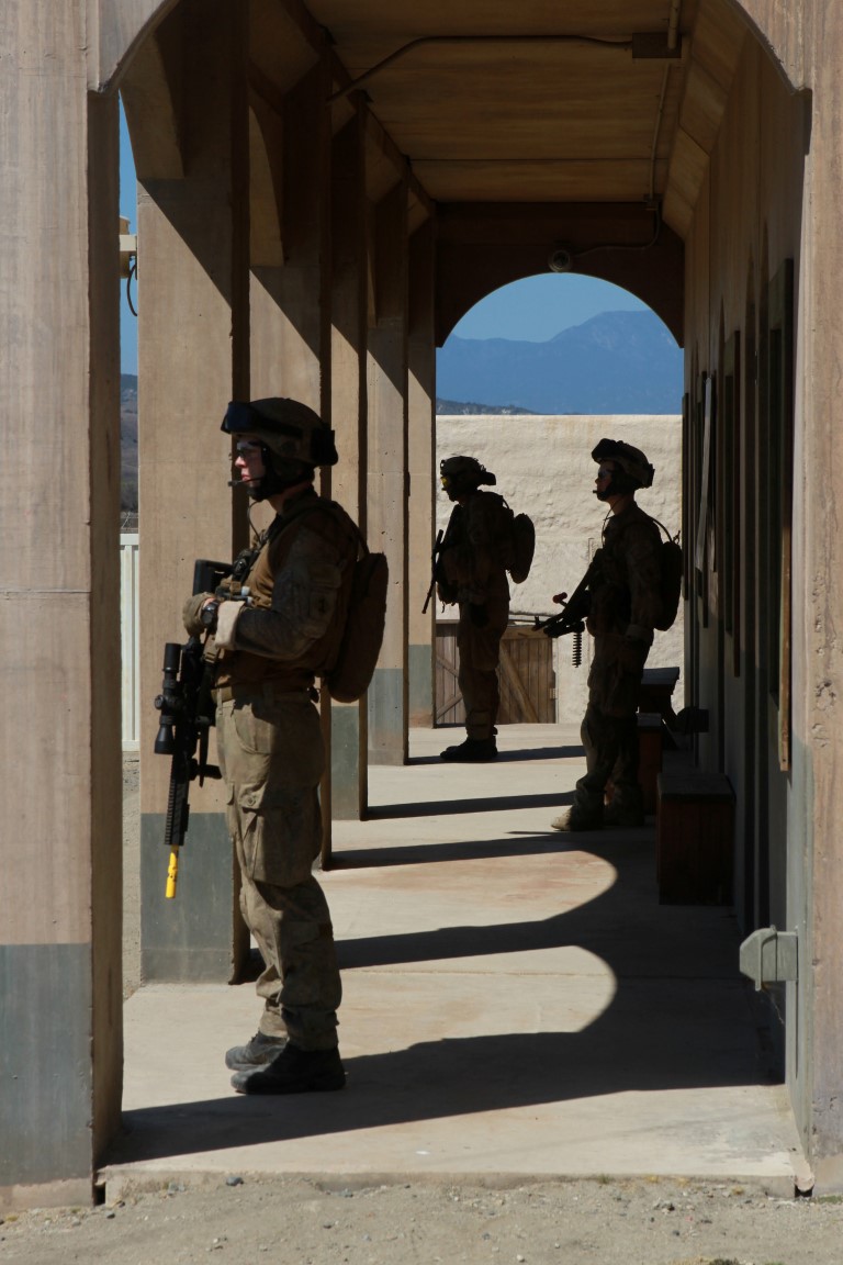 Soldiers with 1st Royal New Zealand Infantry Regiment stay attentive while on patrol in the Infantry Immersion Trainer during Exercise Dawn Blitz at Marine Corps Base Camp Pendleton, Calif., Sept. 7, 2015. The IIT is a training facility that provides individuals with stressful scenarios they might encounter during combat operations in urban areas. Dawn Blitz is a multinational amphibious exercise that promotes interoperability between the U.S. Navy, Marine Corps and coalition partners. (U.S. Marine Corps photo taken by Sgt. Joseph Scanlan)