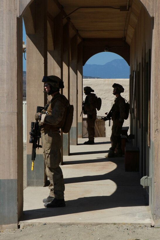 Soldiers with 1st Royal New Zealand Infantry Regiment stay attentive while on patrol in the Infantry Immersion Trainer during Exercise Dawn Blitz at Marine Corps Base Camp Pendleton, Calif., Sept. 7, 2015. The IIT is a training facility that provides individuals with stressful scenarios they might encounter during combat operations in urban areas. Dawn Blitz is a multinational amphibious exercise that promotes interoperability between the U.S. Navy, Marine Corps and coalition partners. (U.S. Marine Corps photo taken by Sgt. Joseph Scanlan)
