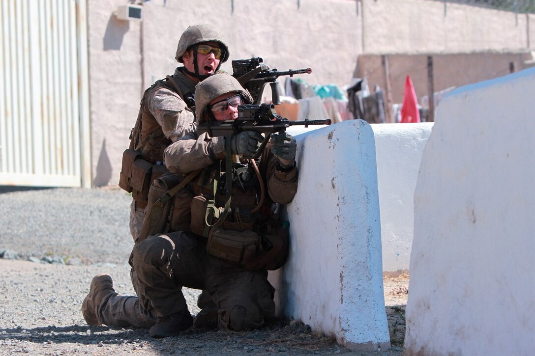 Soldiers with 1st Royal New Zealand Infantry Regiment engage enemy role players in the Infantry Immersion Trainer during Exercise Dawn Blitz at Marine Corps Base Camp Pendleton, Calif., Sept. 7, 2015. The IIT is a training facility that provides individuals with stressful scenarios they might encounter during combat operations in urban areas. Dawn Blitz is a multinational amphibious exercise that promotes interoperability between the U.S. Navy, Marine Corps and coalition partners. (U.S. Marine Corps photo taken by Sgt. Joseph Scanlan)