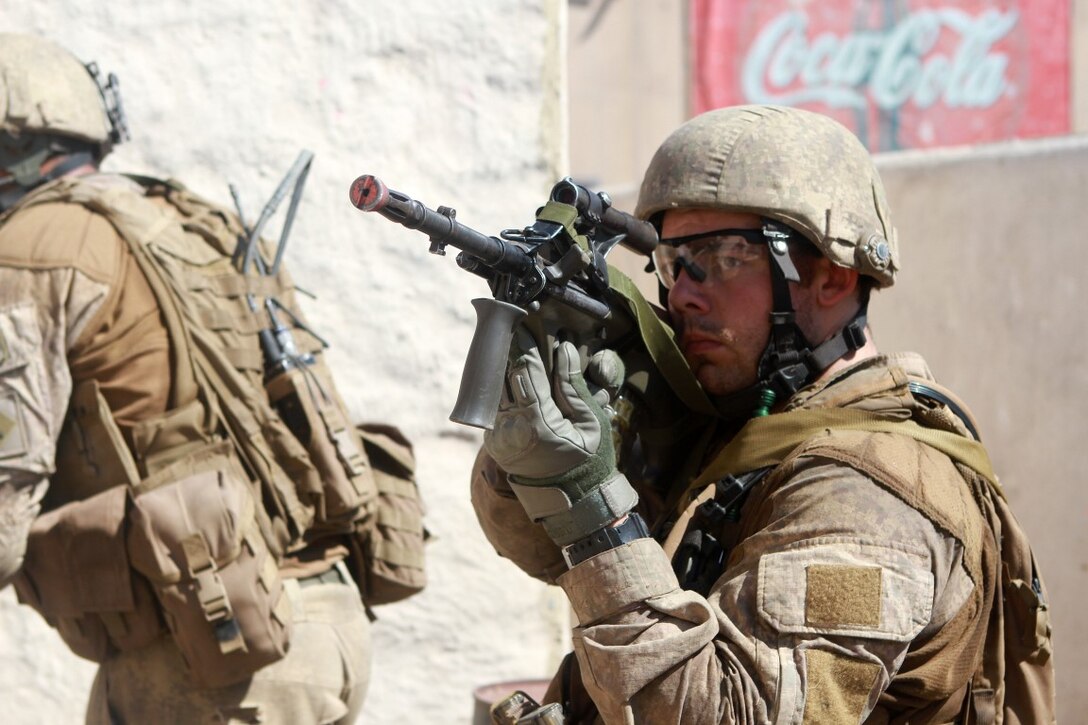 A soldier with 1st Royal New Zealand Infantry Regiment provides security while on patrol in the Infantry Immersion Trainer during Exercise Dawn Blitz at Marine Corps Base Camp Pendleton, Calif., Sept. 7, 2015. The IIT is a training facility that provides individuals with stressful scenarios they might encounter during combat operations in urban areas. Dawn Blitz is a multinational amphibious exercise that promotes interoperability between the U.S. Navy, Marine Corps and coalition partners. (U.S. Marine Corps photo taken by Sgt. Joseph Scanlan)