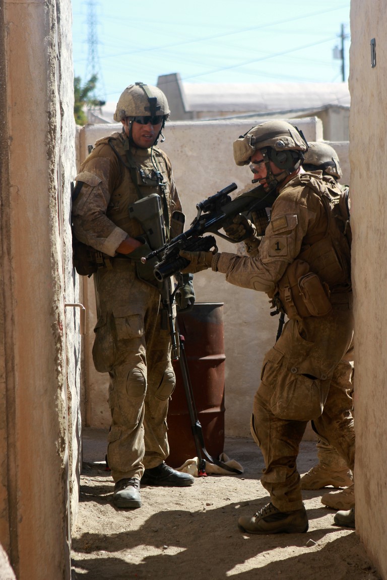 A soldier with 1st Royal New Zealand Infantry Regiment prepares to breach a door in the Infantry Immersion Trainer during Exercise Dawn Blitz at Marine Corps Base Camp Pendleton, Calif., Sept. 7, 2015. The IIT is a training facility that provides individuals with stressful scenarios they might encounter during combat operations in urban areas. Dawn Blitz is a multinational amphibious exercise that promotes interoperability between the U.S. Navy, Marine Corps and coalition partners. (U.S. Marine Corps photo taken by Sgt. Joseph Scanlan)