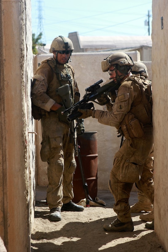 A soldier with 1st Royal New Zealand Infantry Regiment prepares to breach a door in the Infantry Immersion Trainer during Exercise Dawn Blitz at Marine Corps Base Camp Pendleton, Calif., Sept. 7, 2015. The IIT is a training facility that provides individuals with stressful scenarios they might encounter during combat operations in urban areas. Dawn Blitz is a multinational amphibious exercise that promotes interoperability between the U.S. Navy, Marine Corps and coalition partners. (U.S. Marine Corps photo taken by Sgt. Joseph Scanlan)