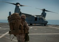 PACIFIC OCEAN (Sept. 5, 2015) – A U.S. Marine assigned to 5th Marine Regiment Headquarters prepares to board an MV-22B Tilt-rotor Osprey assigned to Marine Medium Tilt-rotor Squadron (VMM) 163 with 3rd Marine Aircraft Wing during flight operations aboard amphibious transport dock ship USS Somerset (LPD 25) as part of Exercise Dawn Blitz 2015 (DB-15). Dawn Blitz 2015 is a scenario-driven exercise designed to train the U.S. Navy and Marine Corps in operations expected of an amphibious task force while also building U.S. and coalition operational interoperability. The exercise will test staffs in the planning and execution of amphibious operations in a series of live training events at sea and ashore. (U.S. Navy photo by Mass Communication Specialist 1st Class Vladimir Ramos/Released)