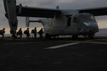 U.S. Marines with 5th Marine Regiment, 1st Marine Division  board an MV-22B Osprey during Exercise Dawn Blitz, Sept. 5, 2015. Dawn Blitz 2015, a joint multinational amphibious exercise, promotes interoperability between the Navy, Marine Corps and Coalition partners. (U.S. Marine Corps photo by Lance Cpl. Eryn L. Edelman, 3D MAW Combat Camera/Released)