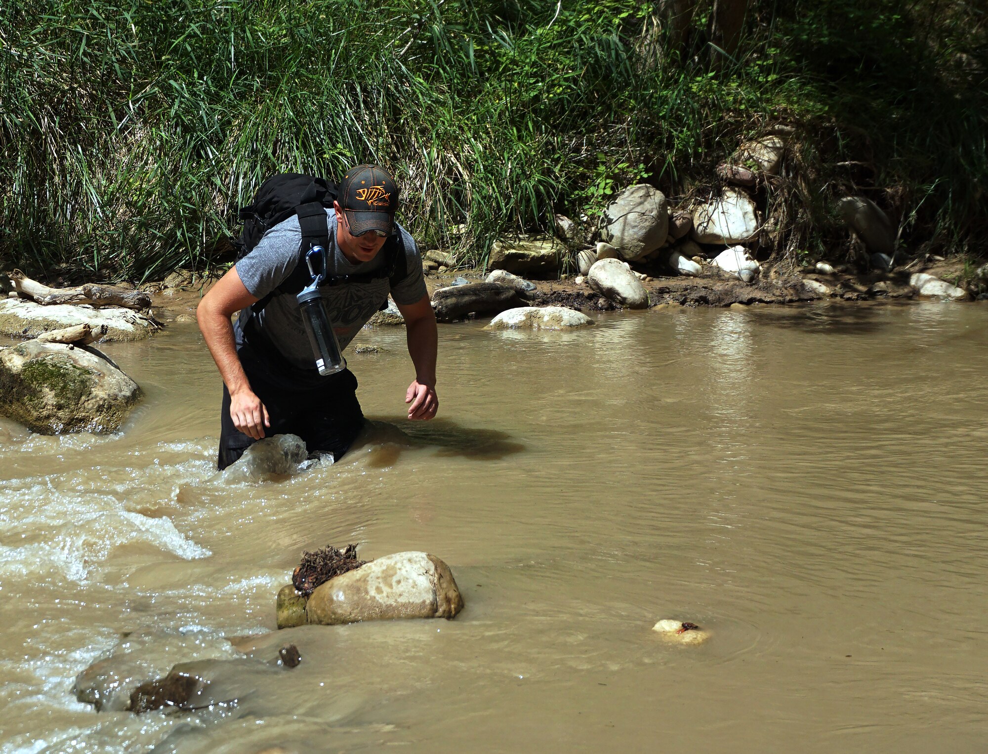 Airman 1st Class Jeffrey Johnson, 90th Civil Engineer Squadron heavy equipment technician on F.E. Warren Air Force Base, Wyo., wades across the Virgin River, Utah, Sept. 5, 2015, during a hike in Zion National Park. A group of 11 Airmen participated in an Outdoor Recreation trip that visited four national parks in four days. (U.S. Air Force photo by Airman 1st Class Brandon Valle)