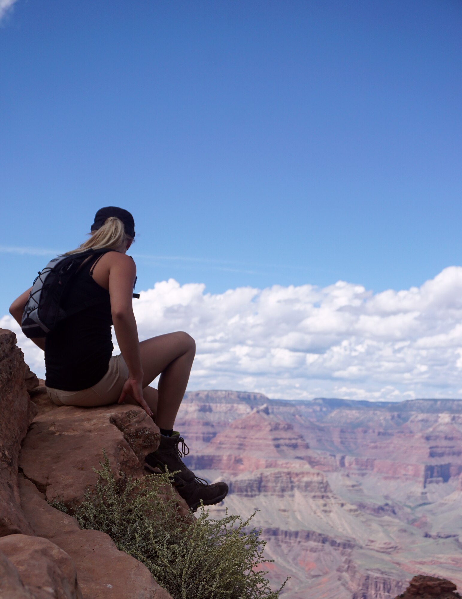 Rachel Bower, F.E. Warren Aquatics Center lifeguard on F.E. Warren Air Force Base, Wyo., peers out over the Grand Canyon National Park, Ariz., Sept. 6, 2015, while taking a break at “Ohh Ahh Point.” The break was the first stop during a seven hour hike on the canyon’s South Kaibab Trail. (U.S. Air Force photo by Airman 1st Class Brandon Valle)